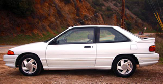 Illustration for article titled For $3,000, This 1991 Ford Escort GT Says Take Me Out